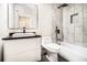 Modern bathroom with a stylish vanity, black fixtures, and tiled shower/tub combination at 2402 Lynn Iris Dr, Decatur, GA 30032