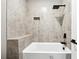 Bathroom tub and shower with tiled surround, niche, and modern black fixtures at 2402 Lynn Iris Dr, Decatur, GA 30032