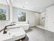 Bright bathroom with double sink vanity, tub, and walk-in shower at 2402 Lynn Iris Dr, Decatur, GA 30032