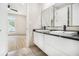 Bathroom featuring double sinks, a modern vanity, and a sleek design at 2402 Lynn Iris Dr, Decatur, GA 30032