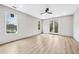 Bright bedroom with hardwood floors, ceiling fan, balcony access, and large windows at 2402 Lynn Iris Dr, Decatur, GA 30032