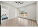 Bright bedroom featuring an ensuite bathroom, large windows, and a modern ceiling fan at 2402 Lynn Iris Dr, Decatur, GA 30032