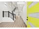 Bright entryway showcasing a staircase with wooden steps and black metal railings at 2402 Lynn Iris Dr, Decatur, GA 30032