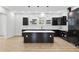 Modern kitchen featuring sleek black cabinets, a center island, and pendant lighting over the island at 2402 Lynn Iris Dr, Decatur, GA 30032
