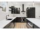 Stylish kitchen with white countertops, black cabinets, island, and modern appliances, perfect for cooking and entertaining at 2402 Lynn Iris Dr, Decatur, GA 30032