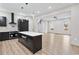 Open-concept kitchen and living area featuring modern appliances and an island with a built-in dishwasher at 2402 Lynn Iris Dr, Decatur, GA 30032