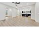 Open-concept living area with a ceiling fan, views to the kitchen and outdoors, and light-colored floors at 2402 Lynn Iris Dr, Decatur, GA 30032
