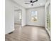 Bright living room featuring LVP flooring, a modern ceiling fan, and natural light filtering through the windows at 2402 Lynn Iris Dr, Decatur, GA 30032