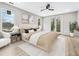 Bright main bedroom featuring a ceiling fan, balcony access, and large windows at 2402 Lynn Iris Dr, Decatur, GA 30032