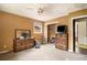 Bedroom with a ceiling fan and a small window, featuring a dresser and view into an adjoining room at 2807 Knollview Dr, Decatur, GA 30034