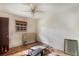 Dated bedroom with two windows, ceiling fan, wood trim, and evidence of water damage requiring renovation at 2807 Knollview Dr, Decatur, GA 30034