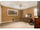 Bedroom with a small window, vintage furniture, and tan carpet needs cosmetic improvements at 2807 Knollview Dr, Decatur, GA 30034