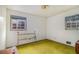 Simple bedroom with original details and a single bed frame, showing signs of needing a renovation at 2807 Knollview Dr, Decatur, GA 30034