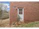 Brick exterior view of the rear of the house with a back door at 2807 Knollview Dr, Decatur, GA 30034
