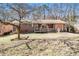 Quaint single-story home featuring a brick facade, front porch with ramp, and a well-maintained lawn at 2807 Knollview Dr, Decatur, GA 30034