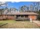Charming single-story brick home with a cozy front porch and a convenient wheelchair ramp at 2807 Knollview Dr, Decatur, GA 30034