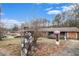 View of single-story home, showcasing stone mailbox, yard, and exterior brick at 2807 Knollview Dr, Decatur, GA 30034