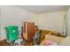 Spacious living room needing refurbishment with a large front window and vintage storage cabinet at 2807 Knollview Dr, Decatur, GA 30034