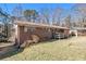 Side view of home with brick and backyard at 2807 Knollview Dr, Decatur, GA 30034
