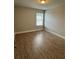 Charming bedroom has neutral paint and durable wood-look laminate flooring at 3592 Hancock Vw, Decatur, GA 30034