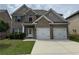 Charming two-story brick home featuring a two-car garage, well-manicured lawn, and inviting curb appeal at 3592 Hancock Vw, Decatur, GA 30034
