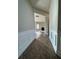 Entryway featuring wood floors, wainscoting, and a glimpse into the bright living area at 3592 Hancock Vw, Decatur, GA 30034
