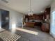 Open kitchen with a large island, stainless steel appliances, and wood-style flooring at 3592 Hancock Vw, Decatur, GA 30034