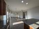 Open-concept living area with wood floors, neutral walls, and recessed lighting at 3592 Hancock Vw, Decatur, GA 30034