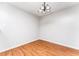 A cozy dining room features new hardwood floors and a modern chandelier, ready for Gathering gatherings at 414 Ridge Creek Dr, Clarkston, GA 30021