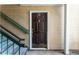 The condo's front door is dark brown with a brass door knocker and gold hardware and is accessed via exterior stairs at 414 Ridge Creek Dr, Clarkston, GA 30021
