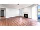 Bright living room featuring wood flooring, a fireplace, and slider door at 414 Ridge Creek Dr, Clarkston, GA 30021