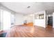 Bright living room with hardwood floors adjacent to the kitchen, offering an open-concept design at 414 Ridge Creek Dr, Clarkston, GA 30021