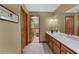 Bathroom boasting lots of counter space, wood cabinets, and open doorway to the toilet and shower at 130 Plantation Dr, Stockbridge, GA 30281