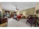 Spacious bedroom with ceiling fan, natural light, and traditional furnishings and warm color palette at 130 Plantation Dr, Stockbridge, GA 30281