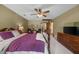Large bedroom featuring a four-poster bed, dresser and other traditional-style furnishings at 130 Plantation Dr, Stockbridge, GA 30281