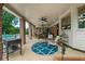 Outdoor covered patio with brick columns, ceiling fans, and a view of the pool at 130 Plantation Dr, Stockbridge, GA 30281