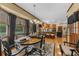 Bright dining room with views into the backyard, hardwood floors and a full formal dining set at 130 Plantation Dr, Stockbridge, GA 30281