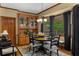 Classic dining room with a full dining set, hardwood flooring and a beautiful china cabinet at 130 Plantation Dr, Stockbridge, GA 30281