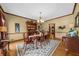 Formal dining room with hardwood floors, a chandelier, and a large china cabinet at 130 Plantation Dr, Stockbridge, GA 30281