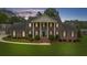 Frontal view of a brick home with white columns, black shutters, and manicured shrubbery at 130 Plantation Dr, Stockbridge, GA 30281