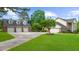 Gated home with a detached three-car garage, ample parking and mature landscaping at 130 Plantation Dr, Stockbridge, GA 30281