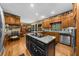 Spacious kitchen with a center island, breakfast bar, stainless appliances, and hardwood floors at 130 Plantation Dr, Stockbridge, GA 30281