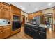Spacious kitchen with stainless appliances, oak cabinets, granite countertops and an adjacent dining area at 130 Plantation Dr, Stockbridge, GA 30281