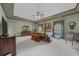 Spacious main bedroom with tray ceilings, wooden trim, and ample natural light at 130 Plantation Dr, Stockbridge, GA 30281