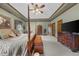 Large main bedroom featuring a four-poster bed, walk in closets, and lots of natural light at 130 Plantation Dr, Stockbridge, GA 30281