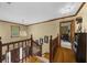 Grand staircase featuring hardwood floors and ornate chandelier at 130 Plantation Dr, Stockbridge, GA 30281