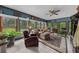 Sunroom offering lots of windows, brick accents, and nice views of the outdoors at 130 Plantation Dr, Stockbridge, GA 30281