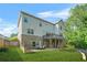 Backyard featuring green lawn, patio set and stairs to upper level deck at 15 Manas Ct, Covington, GA 30016