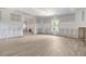 Large basement with modern floors and a window at 15 Manas Ct, Covington, GA 30016