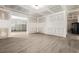 Partially renovated basement with modern floors and open doorways at 15 Manas Ct, Covington, GA 30016